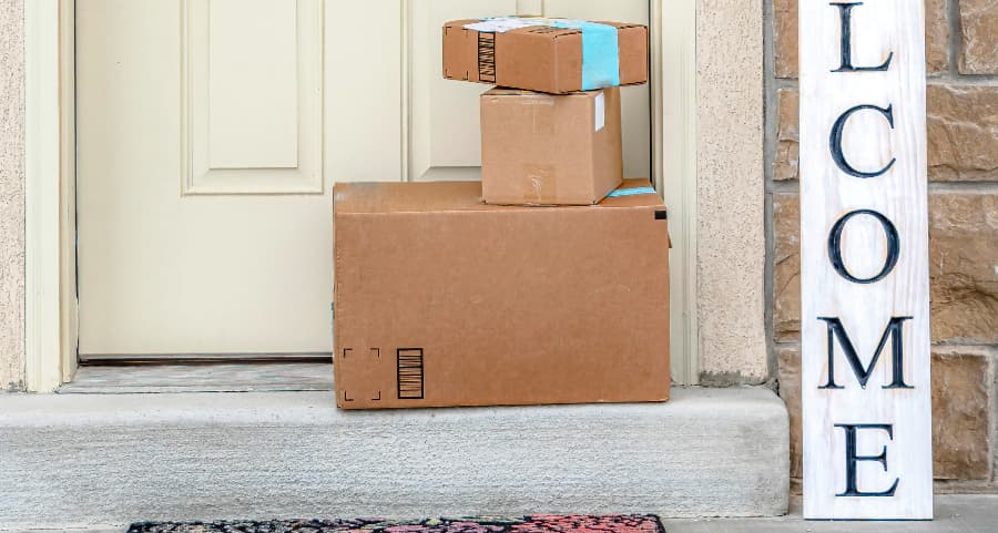 Deliveries on the front porch of a house with a welcome sign in Appleton